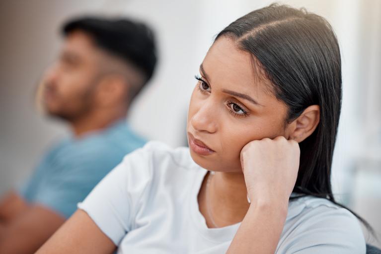 woman of color who appears to be worried