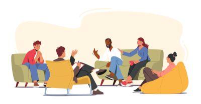 People gathered together in a living room, chatting about life. 