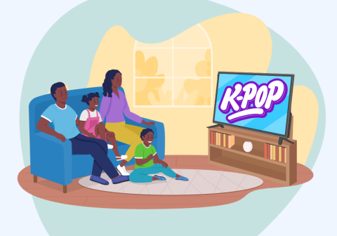 Family sitting in the living room watching a TV that says KPOP