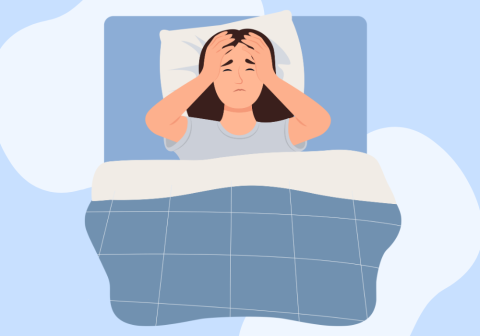 a woman sitting up in bed with her hands on her face unable to sleep
