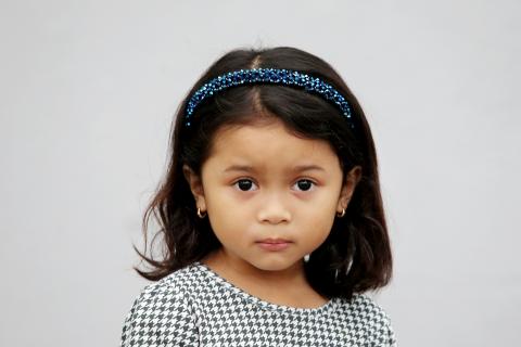 Image of young girl with dark brown hair