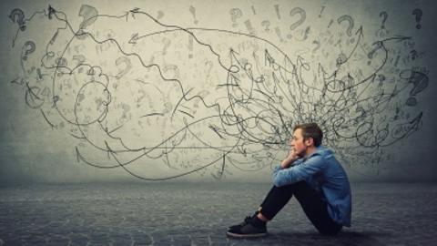 Image of man sitting on floor in deep thought